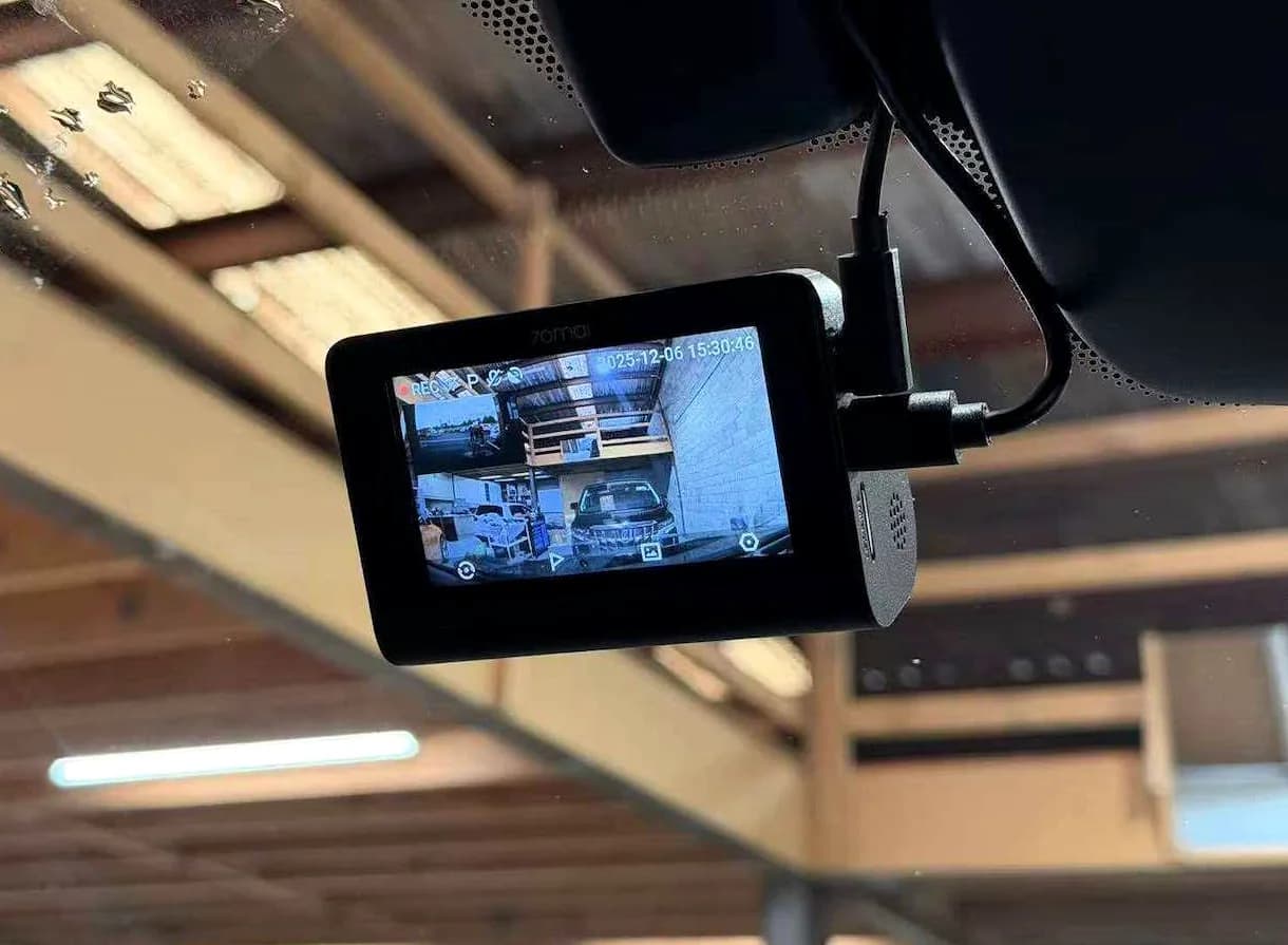 Front and rear dash cam installed on a windscreen with the recording screen active