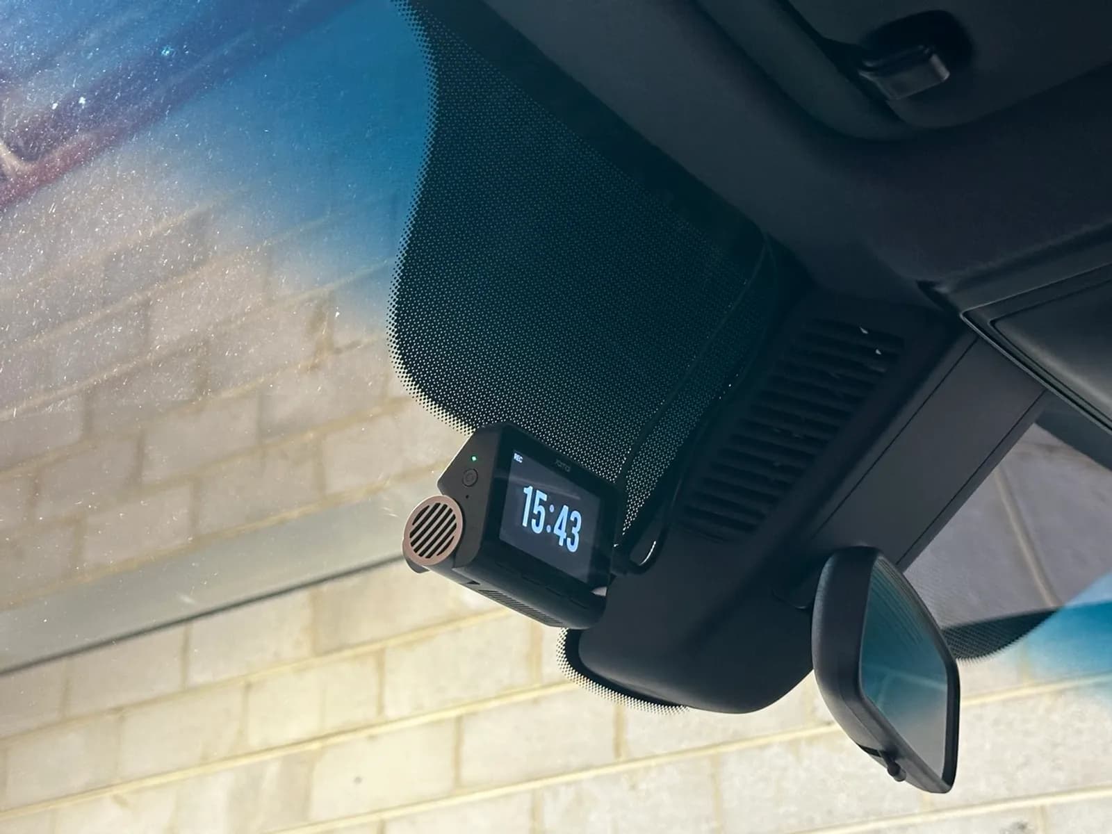 70mai A800se dash cam mounted high on the windscreen beside the rear-view mirror in a Mercedes-Benz Sprinter cab